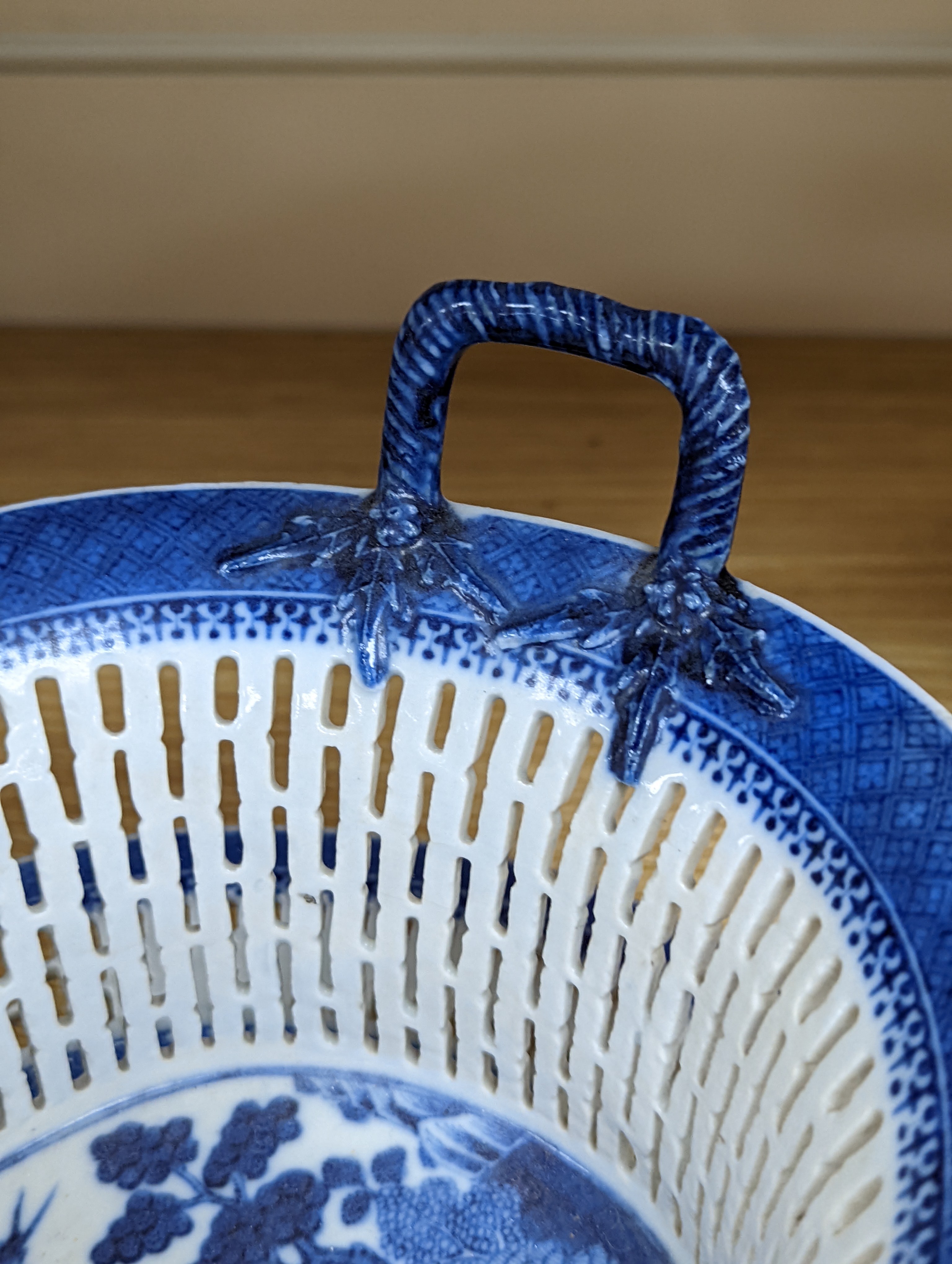 A Chinese blue and white chestnut basket and stand, Qianlong period, basket 11 cms high.